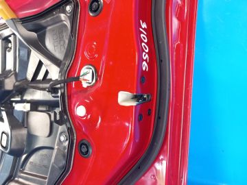 Zamek drzwi przed. praw. MAZDA 3 BL 09-13