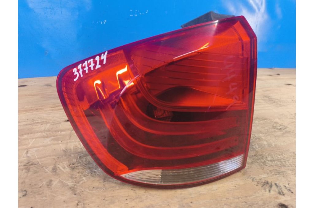 63212990111 | Lampa Tylna lew. BMW X1 E84 09- (377724)